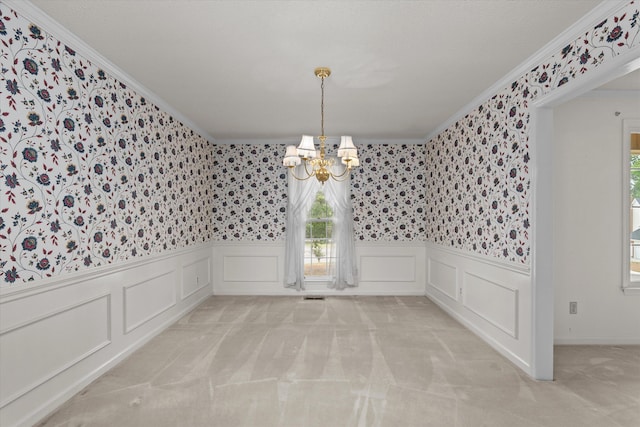 114 Sigman Pl, Martinez, GA 30907 - unfurnished dining area featuring wallpapered walls, a chandelier, ornamental molding, wainscoting, and plenty of natural light