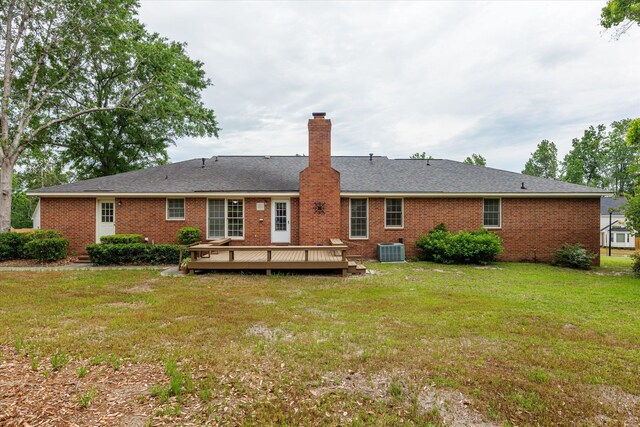 114 Sigman Pl, Martinez, GA 30907 - back of house with central air condition unit, a deck, a chimney, and a yard