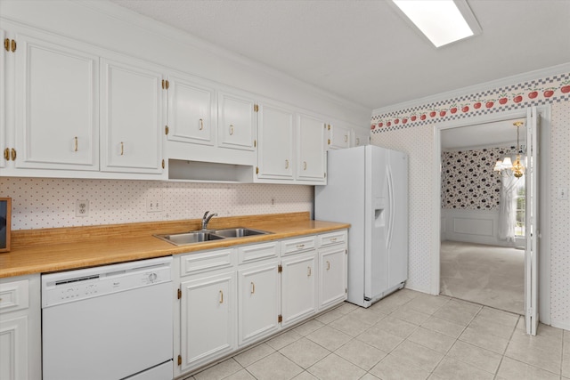 114 Sigman Pl, Martinez, GA 30907 - kitchen featuring white appliances, wallpapered walls, a sink, ornamental molding, and white cabinetry