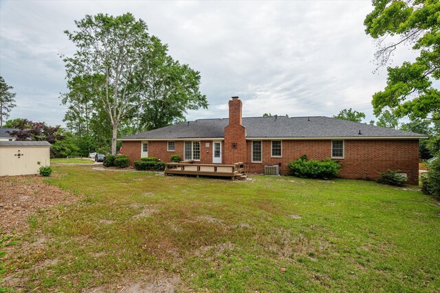 114 Sigman Pl, Martinez, GA 30907 - rear view of property featuring a chimney, brick siding, a yard, a wooden deck, and central AC