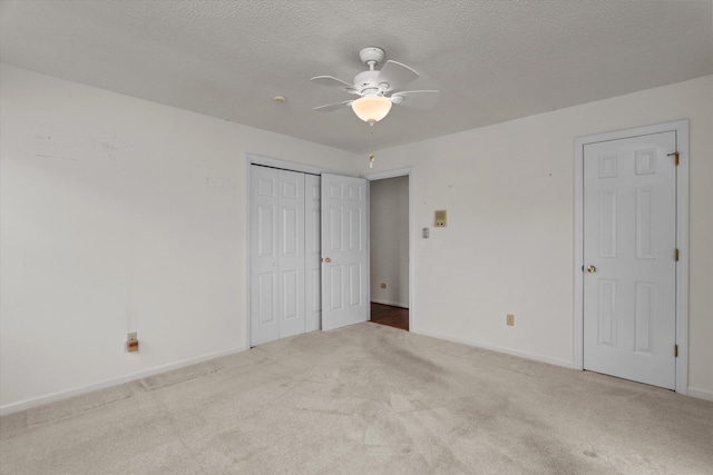 114 Sigman Pl, Martinez, GA 30907 - unfurnished bedroom featuring carpet floors, a textured ceiling, baseboards, a closet, and a ceiling fan