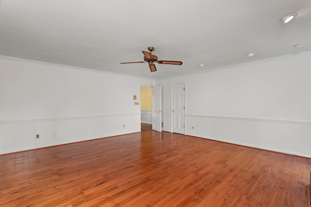 114 Sigman Pl, Martinez, GA 30907 - empty room with a ceiling fan, wood finished floors, a wainscoted wall, crown molding, and recessed lighting
