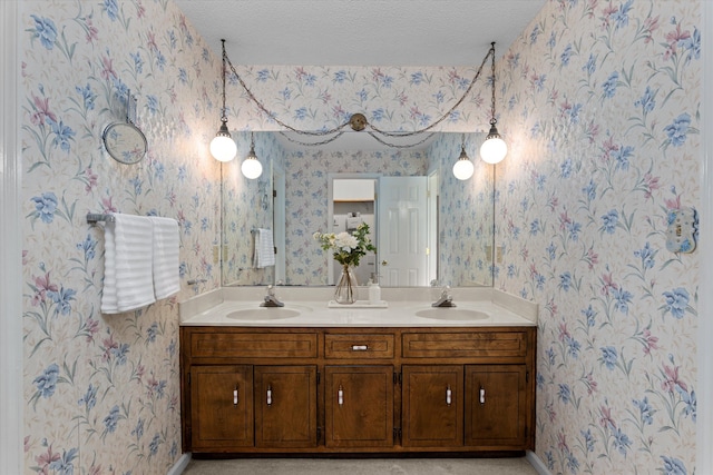 114 Sigman Pl, Martinez, GA 30907 - bathroom featuring wallpapered walls, double vanity, baseboards, and a textured ceiling