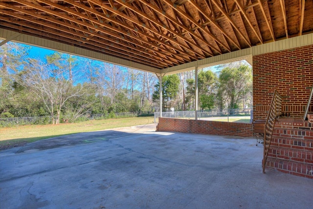 view of patio featuring fence