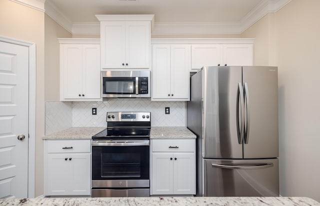 6047 Bakerville Ln, North Augusta, SC 29860 - kitchen with appliances with stainless steel finishes, tasteful backsplash, white cabinets, light stone counters, and crown molding