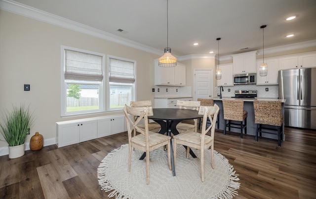6047 Bakerville Ln, North Augusta, SC 29860 - dining room with crown molding, dark wood-style flooring, and recessed lighting