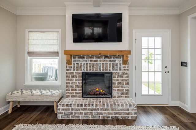 6047 Bakerville Ln, North Augusta, SC 29860 - living room featuring wood finished floors, crown molding, and a brick fireplace