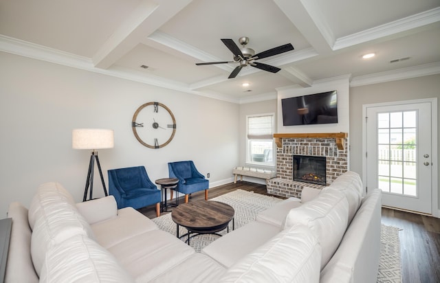 6047 Bakerville Ln, North Augusta, SC 29860 - living room with beam ceiling, dark wood finished floors, crown molding, ceiling fan, and a fireplace