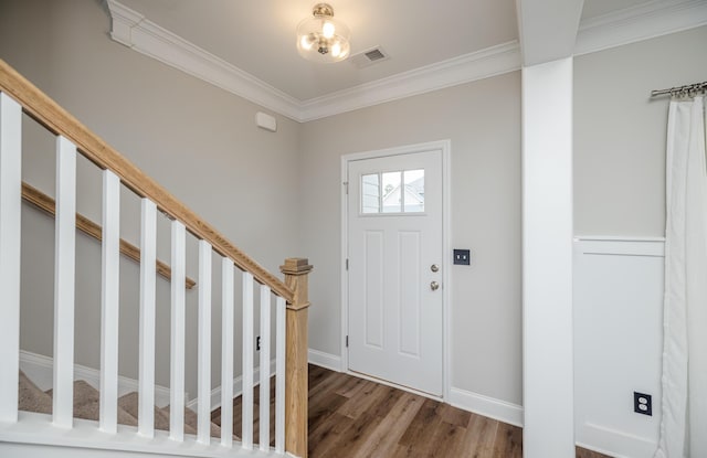 6047 Bakerville Ln, North Augusta, SC 29860 - entryway with ornamental molding, wood finished floors, and stairway