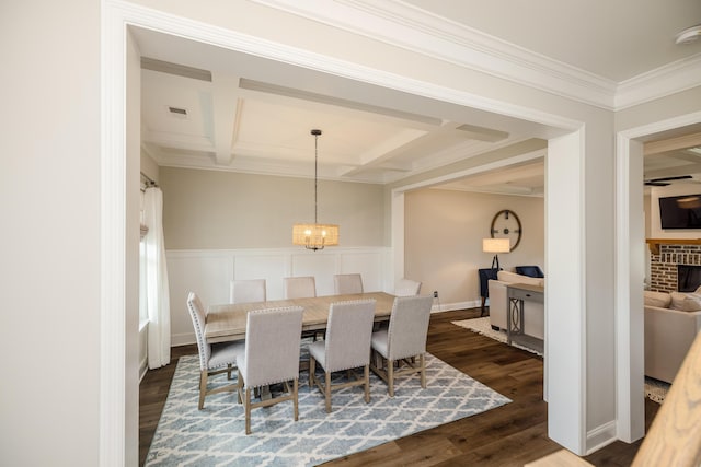 6047 Bakerville Ln, North Augusta, SC 29860 - dining area with coffered ceiling, crown molding, a chandelier, dark wood finished floors, and beamed ceiling