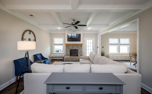 6047 Bakerville Ln, North Augusta, SC 29860 - living room featuring a ceiling fan, dark wood-style flooring, beamed ceiling, a brick fireplace, and coffered ceiling