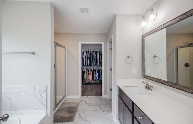 6047 Bakerville Ln, North Augusta, SC 29860 - full bathroom featuring marble look tile flooring, a stall shower, vanity, a walk in closet, and a bath