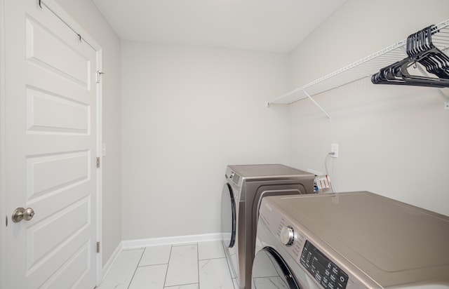 6047 Bakerville Ln, North Augusta, SC 29860 - laundry area featuring separate washer and dryer and light marble finish floors