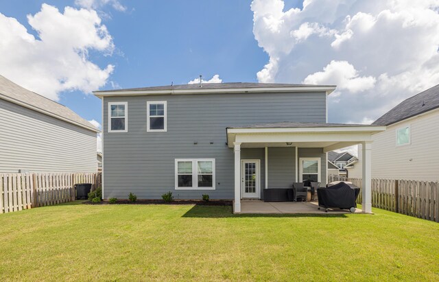 6047 Bakerville Ln, North Augusta, SC 29860 - back of property featuring a patio and a fenced backyard