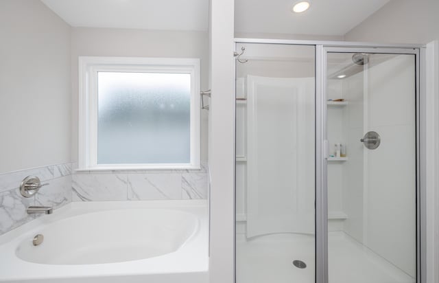 6047 Bakerville Ln, North Augusta, SC 29860 - full bathroom featuring a shower stall, a garden tub, and recessed lighting