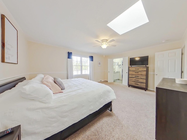 bedroom with light carpet, a skylight, and ceiling fan