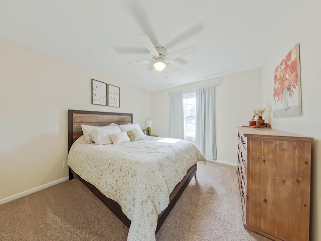 bedroom with baseboards, a ceiling fan, and light colored carpet