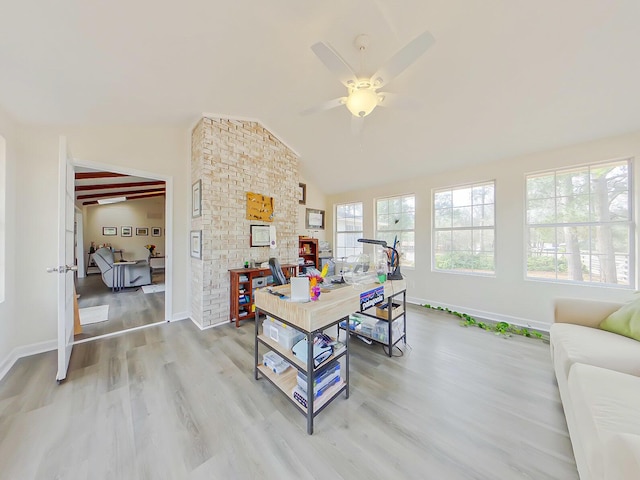 office space featuring lofted ceiling, a ceiling fan, light wood-style flooring, and baseboards