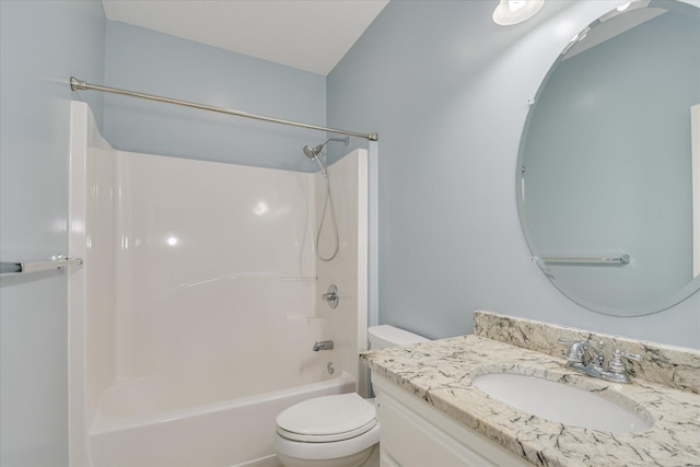 bathroom with toilet, vanity, and bathing tub / shower combination