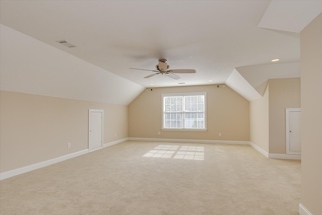 bonus room with light colored carpet, lofted ceiling, ceiling fan, baseboards, and recessed lighting