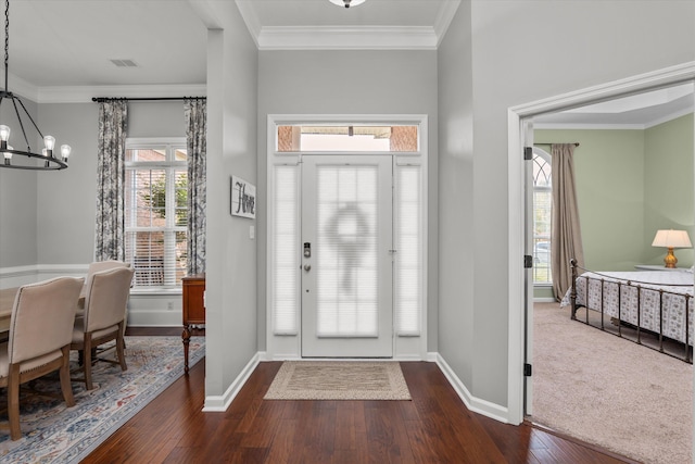 4256 Aerie Cir, Evans, GA 30809 - foyer with a chandelier, dark wood finished floors, ornamental molding, and healthy amount of natural light