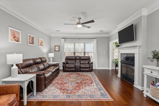 4256 Aerie Cir, Evans, GA 30809 - living area featuring ceiling fan, a tiled fireplace, wood finished floors, and ornamental molding