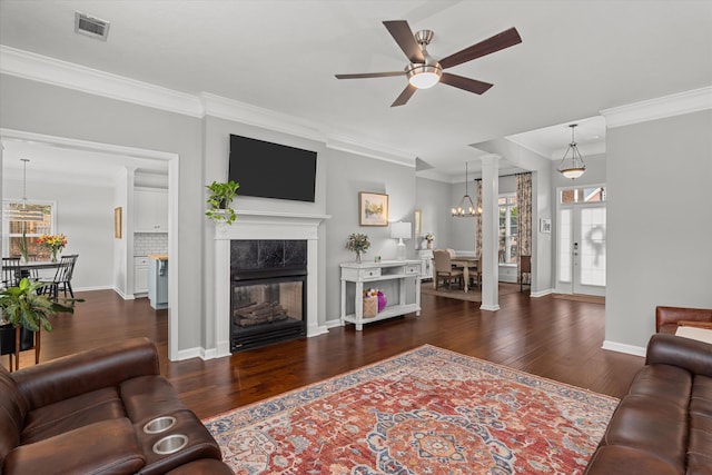 4256 Aerie Cir, Evans, GA 30809 - living area with ornamental molding, plenty of natural light, wood finished floors, a ceiling fan, and a chandelier
