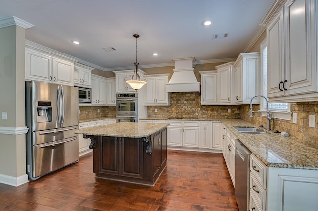 1164 Waltons Pass, Evans, GA 30809 - kitchen featuring stainless steel appliances, premium range hood, dark wood-style floors, light stone counters, and crown molding