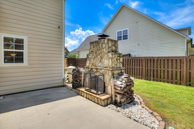 1164 Waltons Pass, Evans, GA 30809 - view of patio / terrace featuring an outdoor stone fireplace