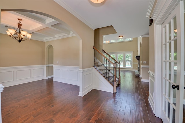 1164 Waltons Pass, Evans, GA 30809 - foyer entrance featuring arched walkways, dark wood-style flooring, ornamental molding, beamed ceiling, and a chandelier