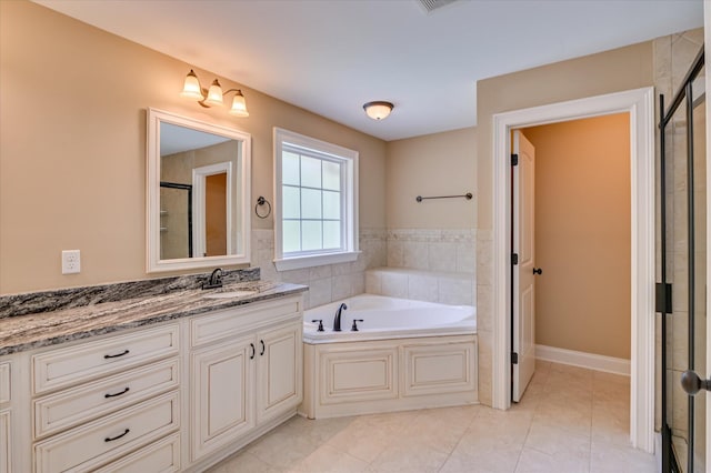 1164 Waltons Pass, Evans, GA 30809 - bathroom featuring vanity, a garden tub, a tile shower, and tile patterned floors