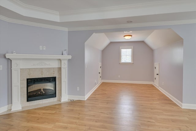 1164 Waltons Pass, Evans, GA 30809 - unfurnished living room with light wood-style flooring, a fireplace, vaulted ceiling, and ornamental molding