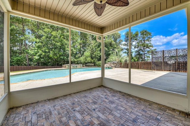 1164 Waltons Pass, Evans, GA 30809 - unfurnished sunroom with a ceiling fan and view of wooded area