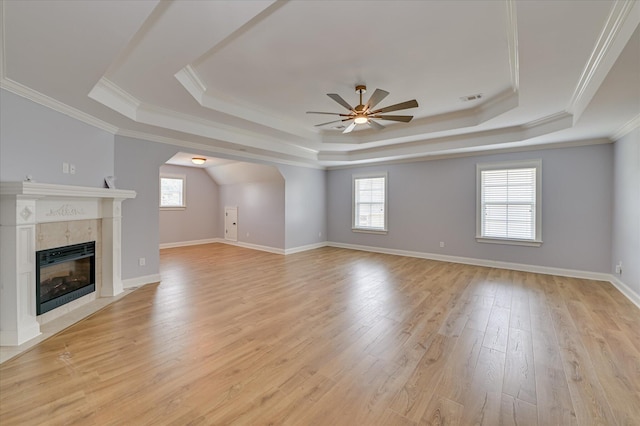 1164 Waltons Pass, Evans, GA 30809 - unfurnished living room with a raised ceiling, ceiling fan, healthy amount of natural light, light wood-style flooring, and ornamental molding