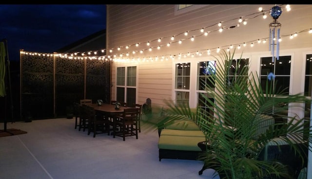 1164 Waltons Pass, Evans, GA 30809 - patio at night with a patio area and outdoor dining area