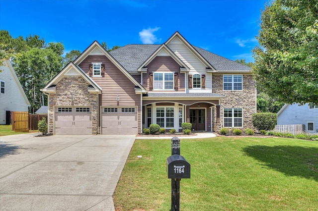 1164 Waltons Pass, Evans, GA 30809 - view of front of property featuring stone siding, concrete driveway, a garage, and roof with shingles