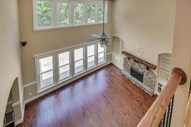 1164 Waltons Pass, Evans, GA 30809 - living room featuring a ceiling fan, a fireplace, dark wood finished floors, and a high ceiling