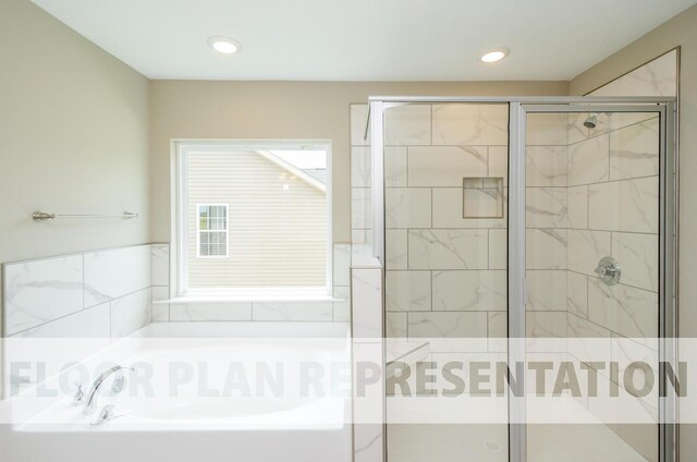 full bathroom featuring a stall shower, a garden tub, and recessed lighting