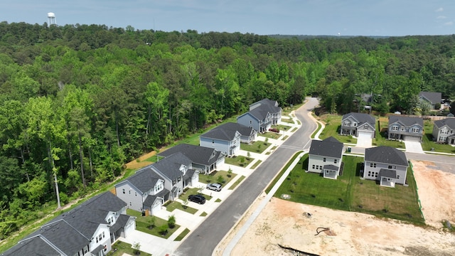 birds eye view of property featuring a residential view and a view of trees