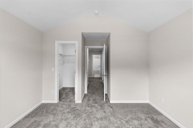 5085 Anna Way Unit Fb28, North Augusta, SC 29841 - unfurnished bedroom featuring carpet flooring, a walk in closet, vaulted ceiling, and a closet