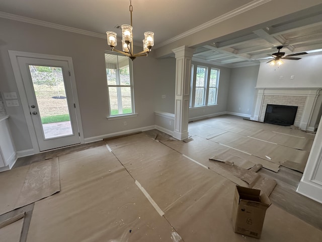 unfurnished living room featuring ornate columns, baseboards, coffered ceiling, and crown molding