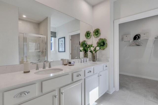 778 Count Fleet Ct, Graniteville, SC 29829 - bathroom with a shower stall, double vanity, a walk in closet, and a sink
