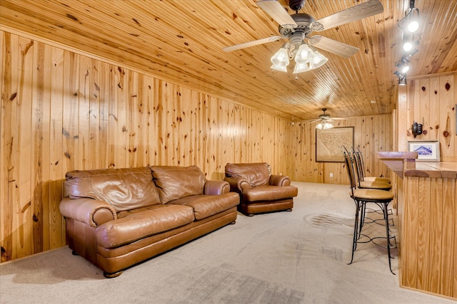81 Two Mile Dr, Johnston, SC 29832 - carpeted living area with wooden walls, wood ceiling, ceiling fan, and a bar