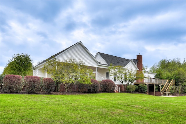 81 Two Mile Dr, Johnston, SC 29832 - view of home's exterior with stairway, a yard, a chimney, and a deck