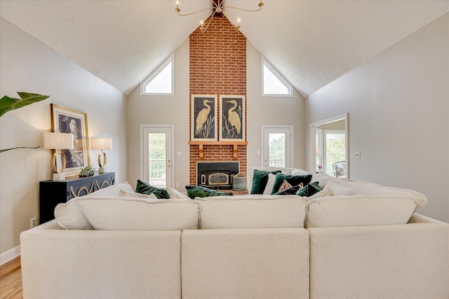81 Two Mile Dr, Johnston, SC 29832 - living area with high vaulted ceiling and light wood-style floors