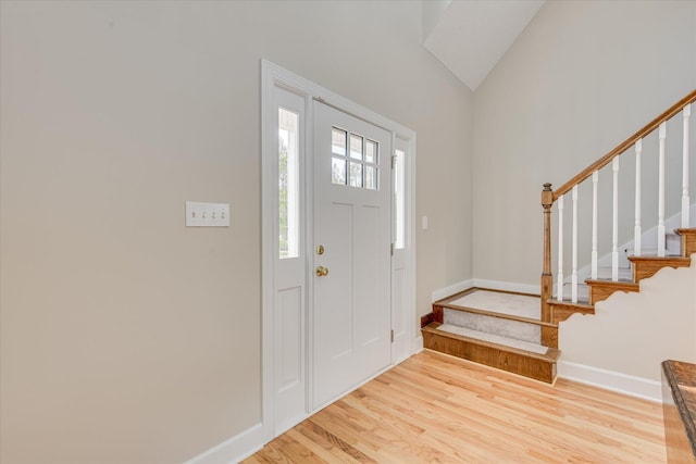81 Two Mile Dr, Johnston, SC 29832 - entrance foyer featuring stairway, light wood finished floors, and lofted ceiling