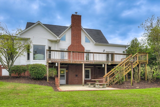 81 Two Mile Dr, Johnston, SC 29832 - rear view of property with a chimney, a lawn, a wooden deck, and a patio area