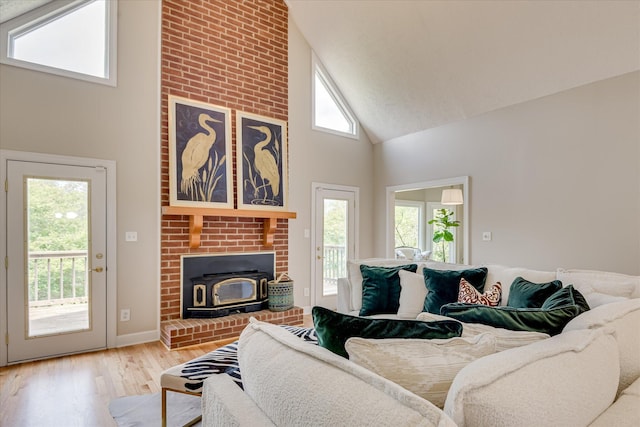 81 Two Mile Dr, Johnston, SC 29832 - living area with high vaulted ceiling, wood finished floors, and a wood stove