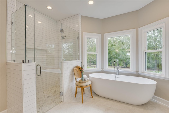 81 Two Mile Dr, Johnston, SC 29832 - full bath featuring a soaking tub, a stall shower, plenty of natural light, and recessed lighting