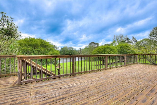 81 Two Mile Dr, Johnston, SC 29832 - wooden terrace featuring a lawn and view of scattered trees